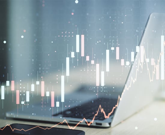 Abstract financial graph on laptop background
