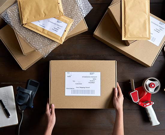 Table top view of worker packing orders
